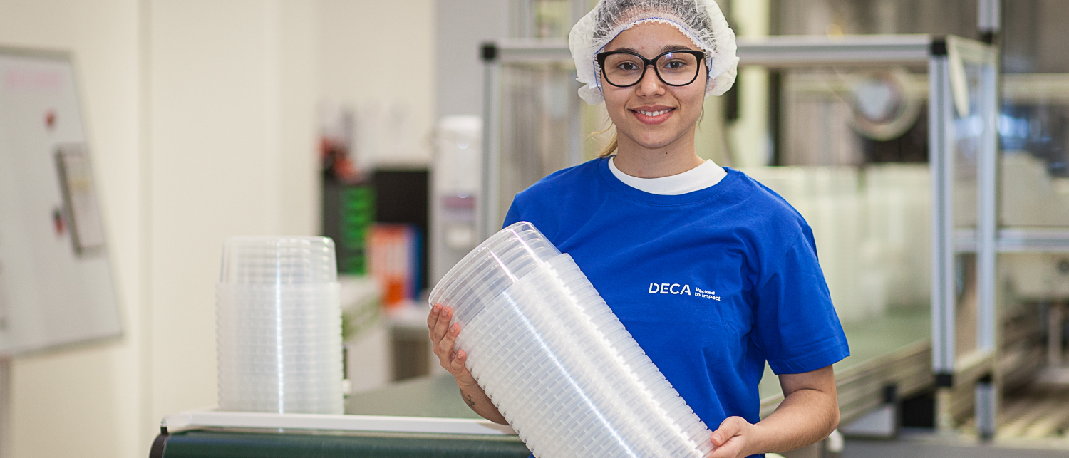 production worker DECA with plastic food containers